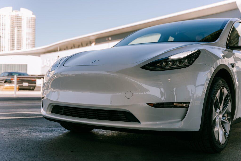 a white Tesla car looking brand new after getting ceramic coating at loves auto detail